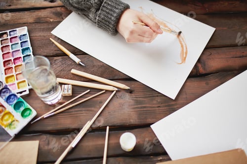 Preview: Painting with Watercolors on Wooden Table Indoors