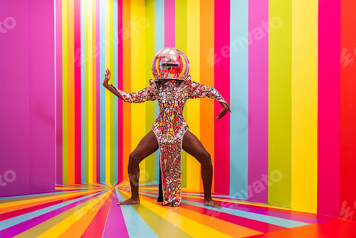 Preview: Beautiful young woman dancing and having fun inside a rainbow box room