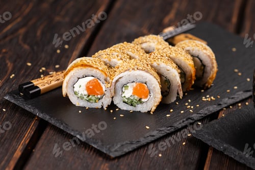 Preview: Sushi roll with smoked eel and salmon with cucumber and cheese. Traditional delicious fresh sushi