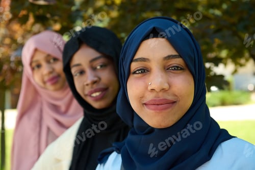 Preview: Smiling Women Wearing Headscarves in an Urban Park
