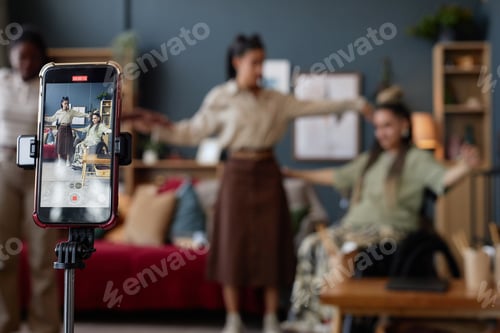 Preview: Young Caucasian Woman with Disability Recording Video with Friends at Home