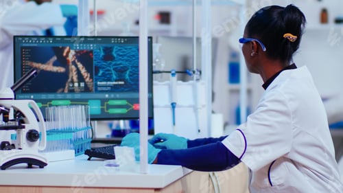 Preview: African woman biochemist researcher checking manifestations of vaccine