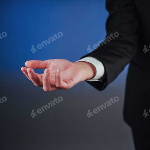 Preview: Young businessman showing empty hands, ready to fill with your design