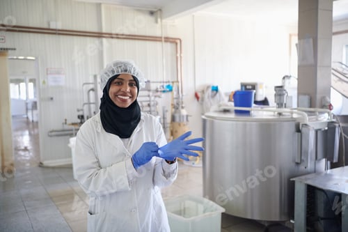 Preview: African black muslim business woman in local cheese production company
