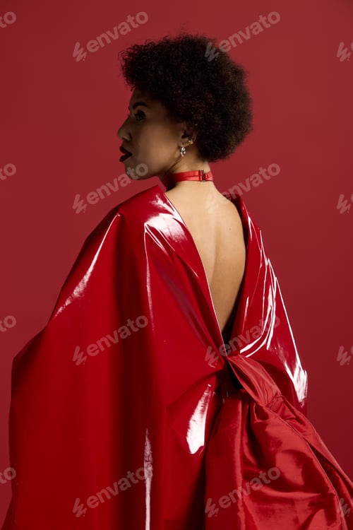 Preview: Captivating beauty in striking red attire radiates elegance and confidence in bold fashion statement