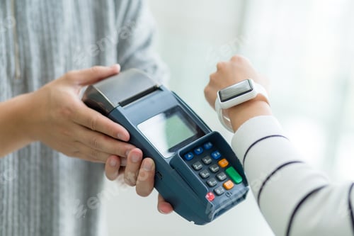 Preview: Woman using cellphone for paying the bill