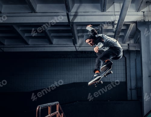 Preview: Young skateboarder at skate park indoor