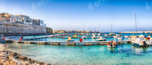 Preview: Several fishing boats at the Otranto harbour - coastal town in Puglia with turquoise sea