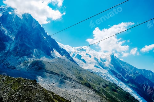 Preview: Cable cars criss-cross the alpine mountain landscape.