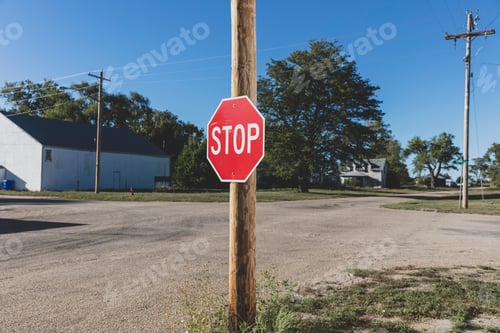 Preview: Stop sign at a road intersection.