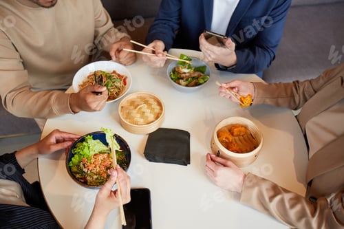 Preview: People Enjoying Asian Food in Cafe