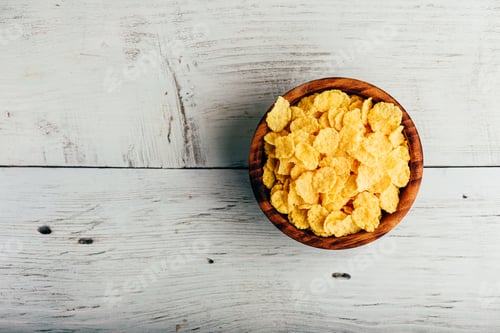 Preview: Corn flakes in a wooden bowl