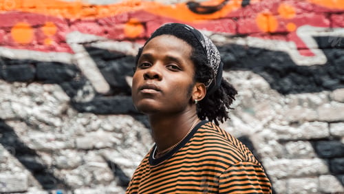 Preview: Portrait of young handsome stylish black man with natural hair afro dreadlocks. Afroamerican guy. St