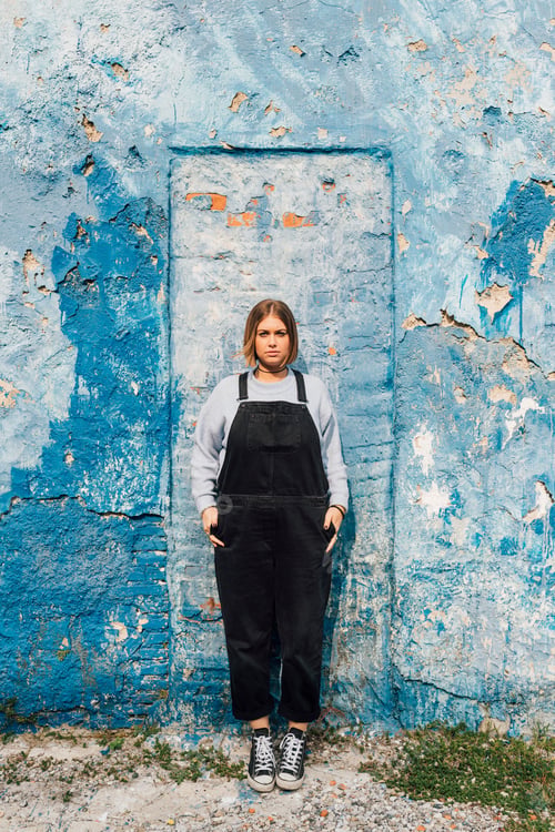 Preview: Portrait of woman, weathered wall in background