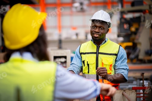 Preview: Young male engineer in metal sheet factory Responsible work is being inspected at actual work site