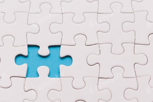 Preview: Unfinished white jigsaw puzzle pieces. One missing jigsaw piece on blue background