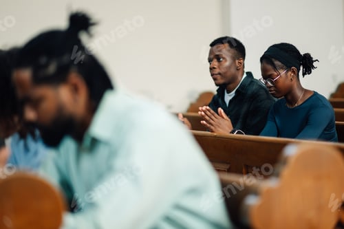 Preview: Congregation praying with priest leading in church service