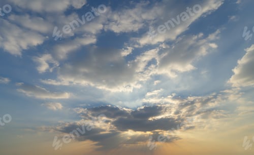 Preview: Sunset sky. Abstract nature background. Dramatic blue and orange, colorful clouds at twilight time.