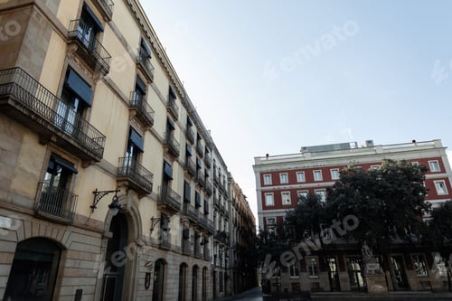 Preview: Old vintage houses apartments on a sunny day in Barcelona, Spain