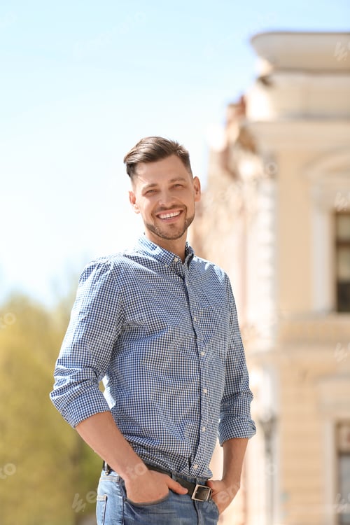 Preview: Portrait of young man in stylish outfit outdoors