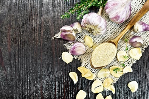 Preview: Garlic ground in spoon on board top