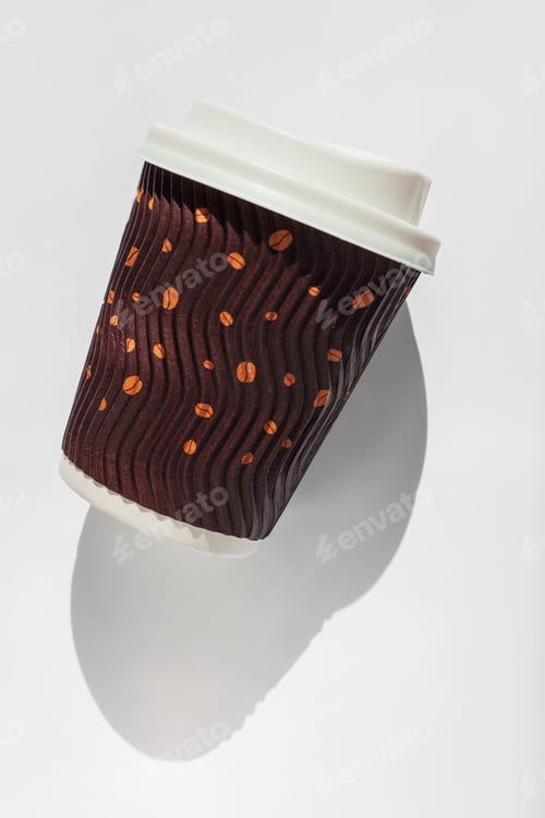 Preview: Coffee to go on a white background isolated. Brown kraft paper cup with black lid, lifestyle concept