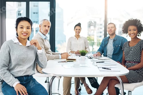 Preview: Portrait of a group of businesspeople having a meeting in a modern office