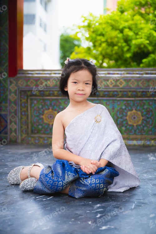 Preview: Beautiful traditional portrait of young Asian child girl wearing an Thai traditional dress.