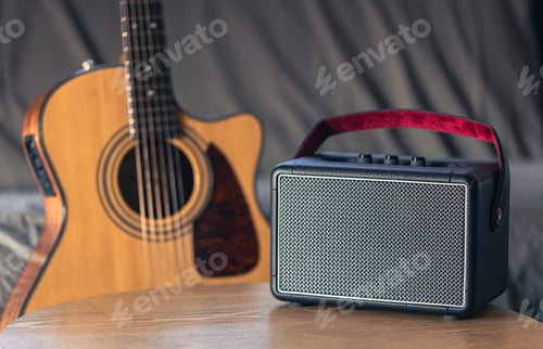 Preview: Close up, music speaker and acoustic guitar in the interior of the room.