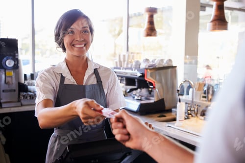 Preview: Cashier Accepts Card Payment From Customer In Delicatessen