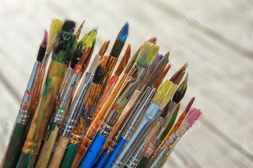 Preview: Different paint brushes on light blurred background, closeup