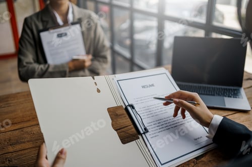 Preview: Close-up of business owner check resume of job applicants in company at the office.
