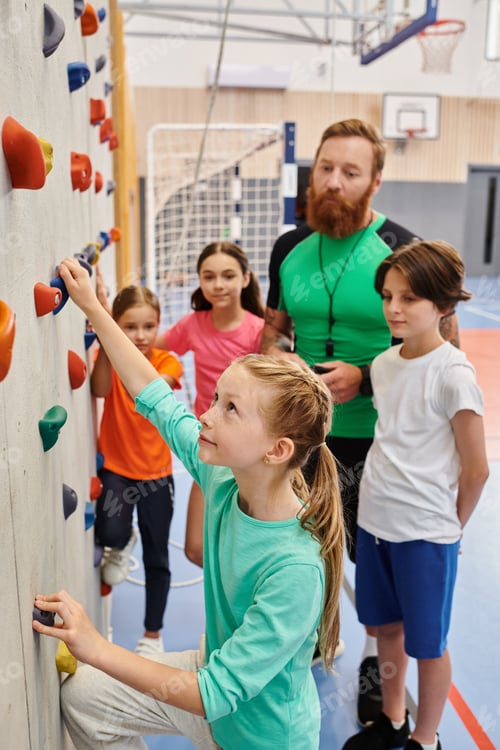 Preview: Adventure beckons: diverse group of kids and adults gather at climbing wall