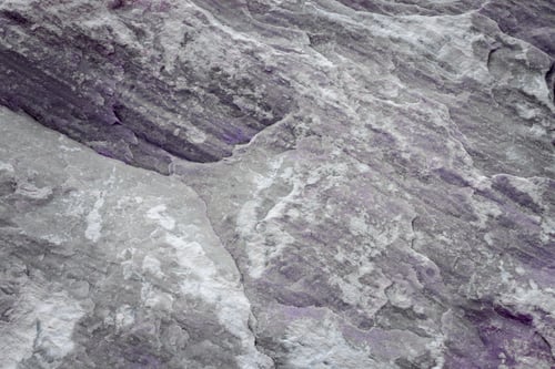 Preview: Background from picture is made of limestone natural stone of pastel color with purple inclusions