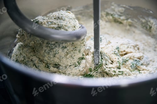 Preview: Process of kneading dough in a professional dough mixer