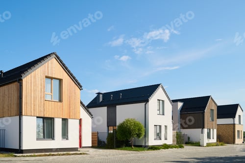 Preview: Perspective view of several small houses standing in row in rural environment