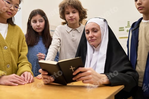 Preview: Caucasian Middle Aged Nun Reading Bible to Diverse Group of Children