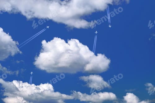 Preview: Many distant passenger jet planes flying on high altitude on clear blue sky leaving white smoke