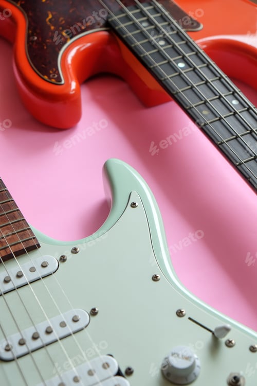Preview: Electric guitar and bass guitar on a pink background