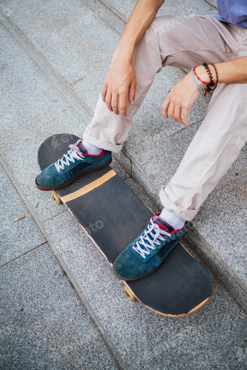 Preview: Legs of young skater man in the city