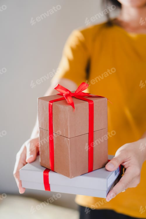Preview: Woman giving a christmas or birthday gift