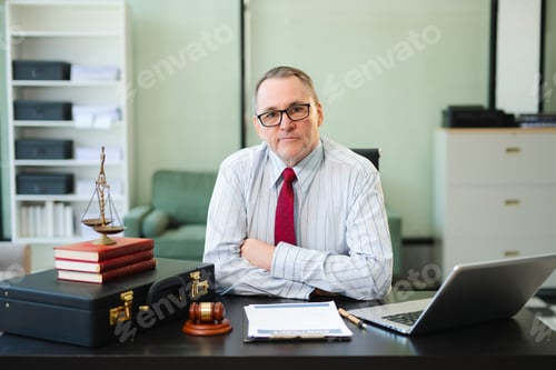 Preview: Caucasian male judge in courtroom, lawyer working in office. Perfect for business,