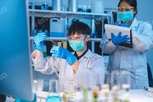 Preview: researcher working in laboratory for medicals science research using scientific equipment technology