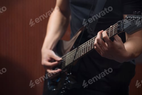 Preview: Young man playing the guitar