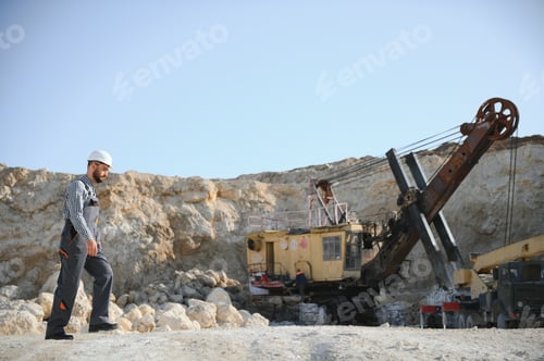 Preview: Male worker with bulldozer in sand quarry