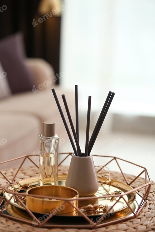 Preview: Composition with stylish accessories and interior elements on wicker pouf indoors