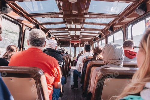 Preview: Group of people riding a bus with glass ceiling.