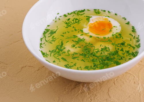 Preview: Chicken soup with egg and dill in white bowl