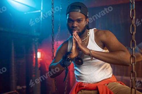 Preview: Stylish rapper poses near the chains in studio