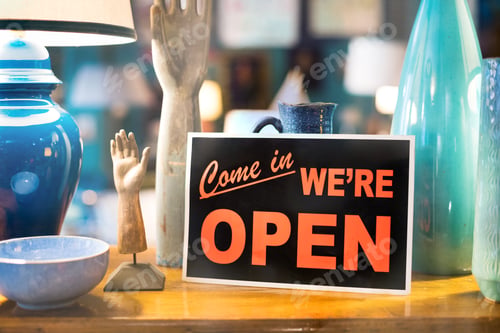 Preview: Come In We're Open sign in a window of a shop or store